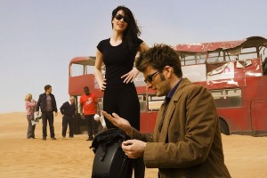 The Doctor examines the sand with Lady Christina