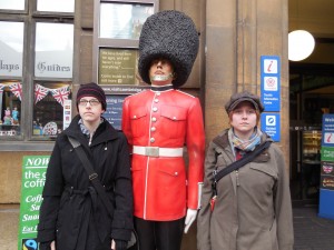 Colleen and Cheryl pose with a Palace Guard statue