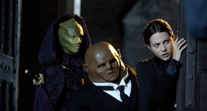 Madam Vastra, Jenny and Strax peer around a corner