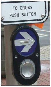 Accessible Pedestrian Signal with large arrow button and speaker 